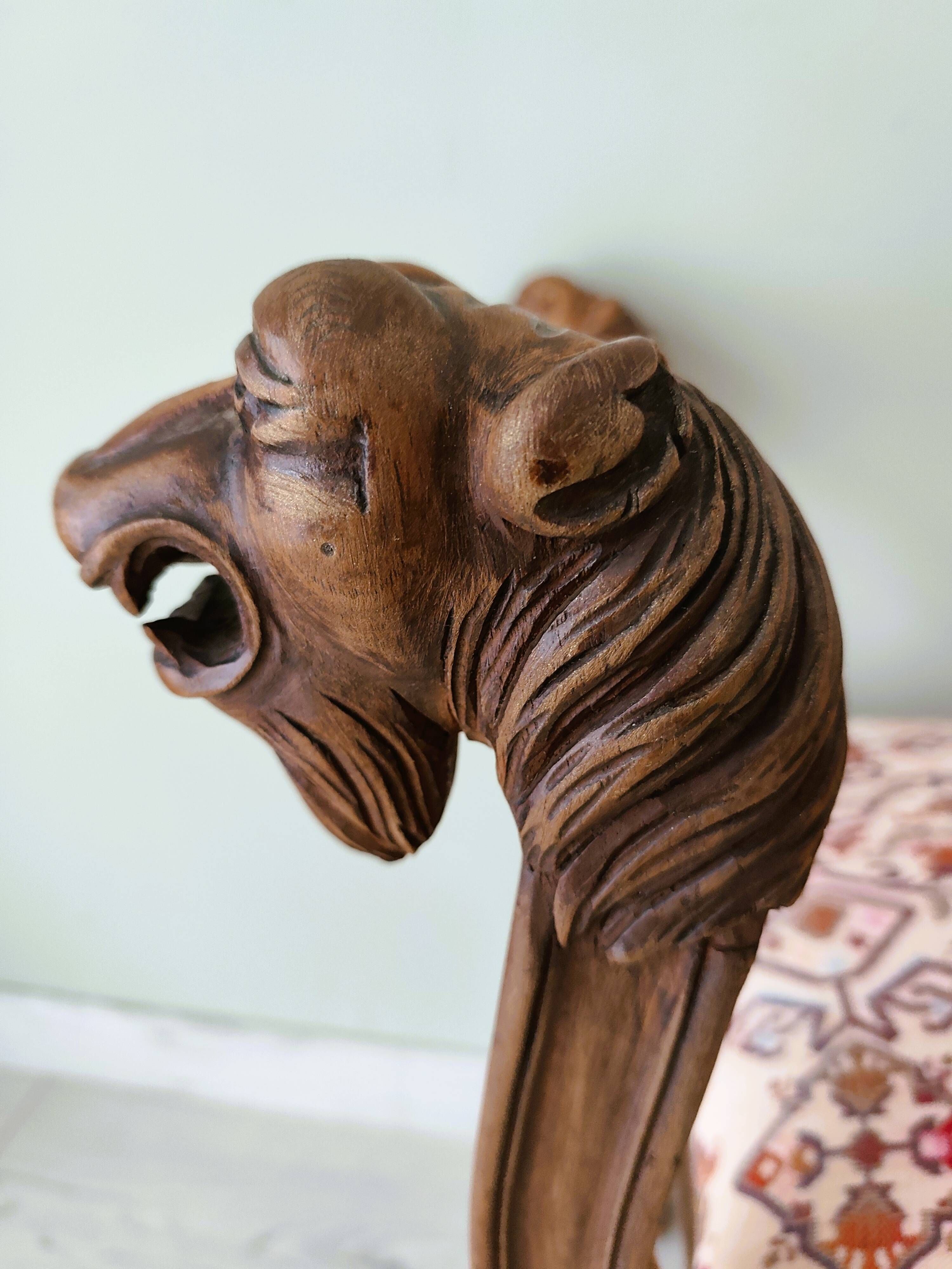Neo-Renaissance banquette style with lion heads