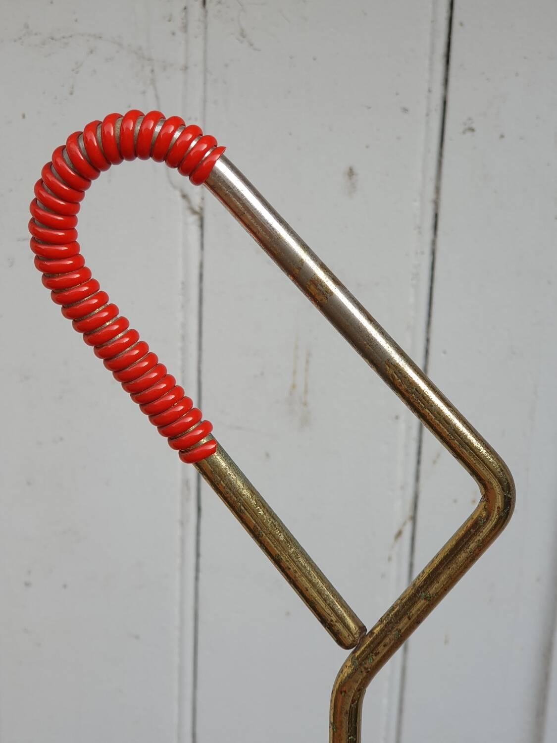 Perforated metal umbrella stand and scoubidou