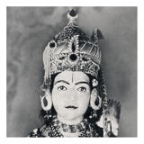 Photograph of a statue of Krishna adorned like an idol