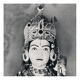 Photographie d'une statue de Krishna parée comme une idole