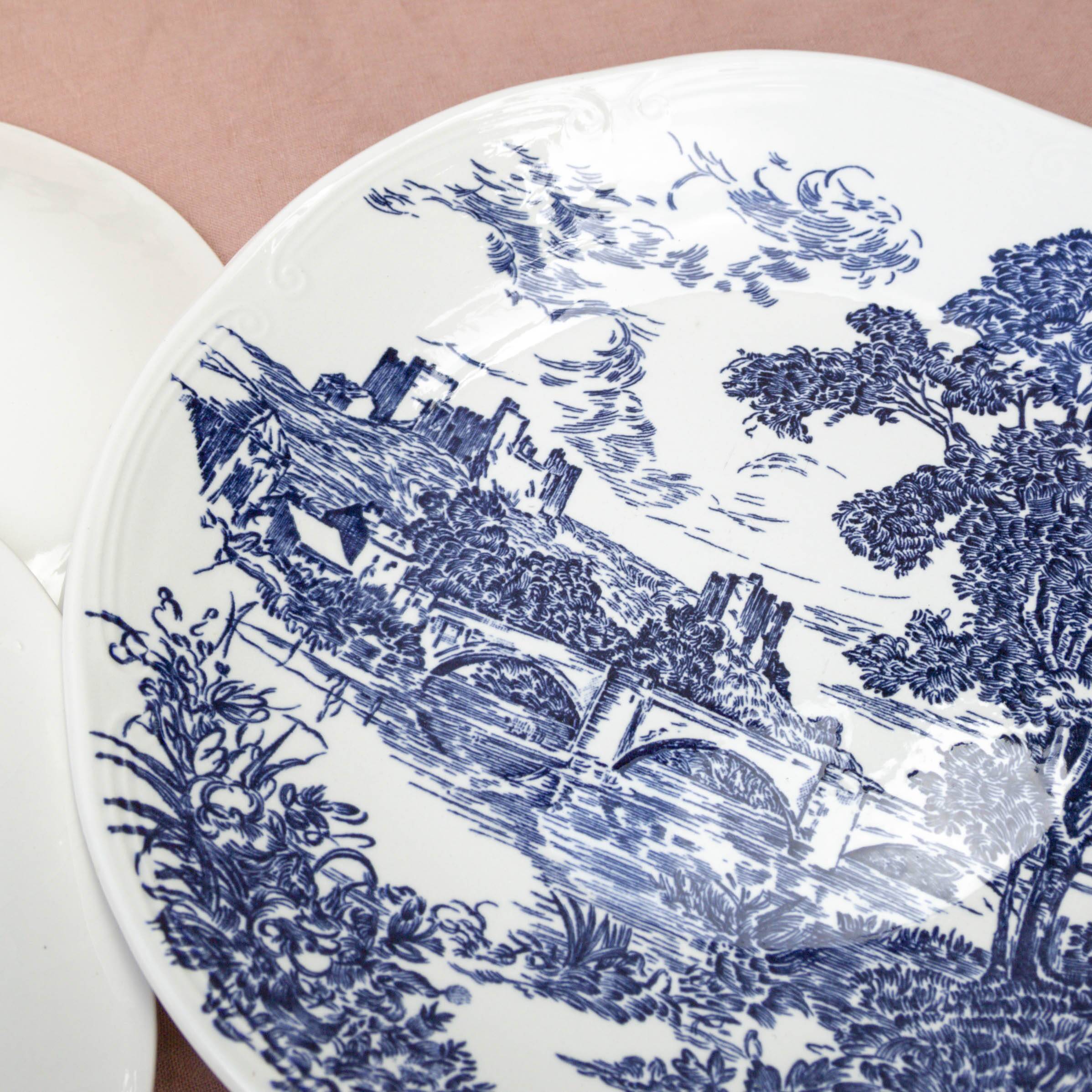 4 blue Gien plates with castle village bridge decor