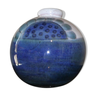 Blue rounded vase with floral details