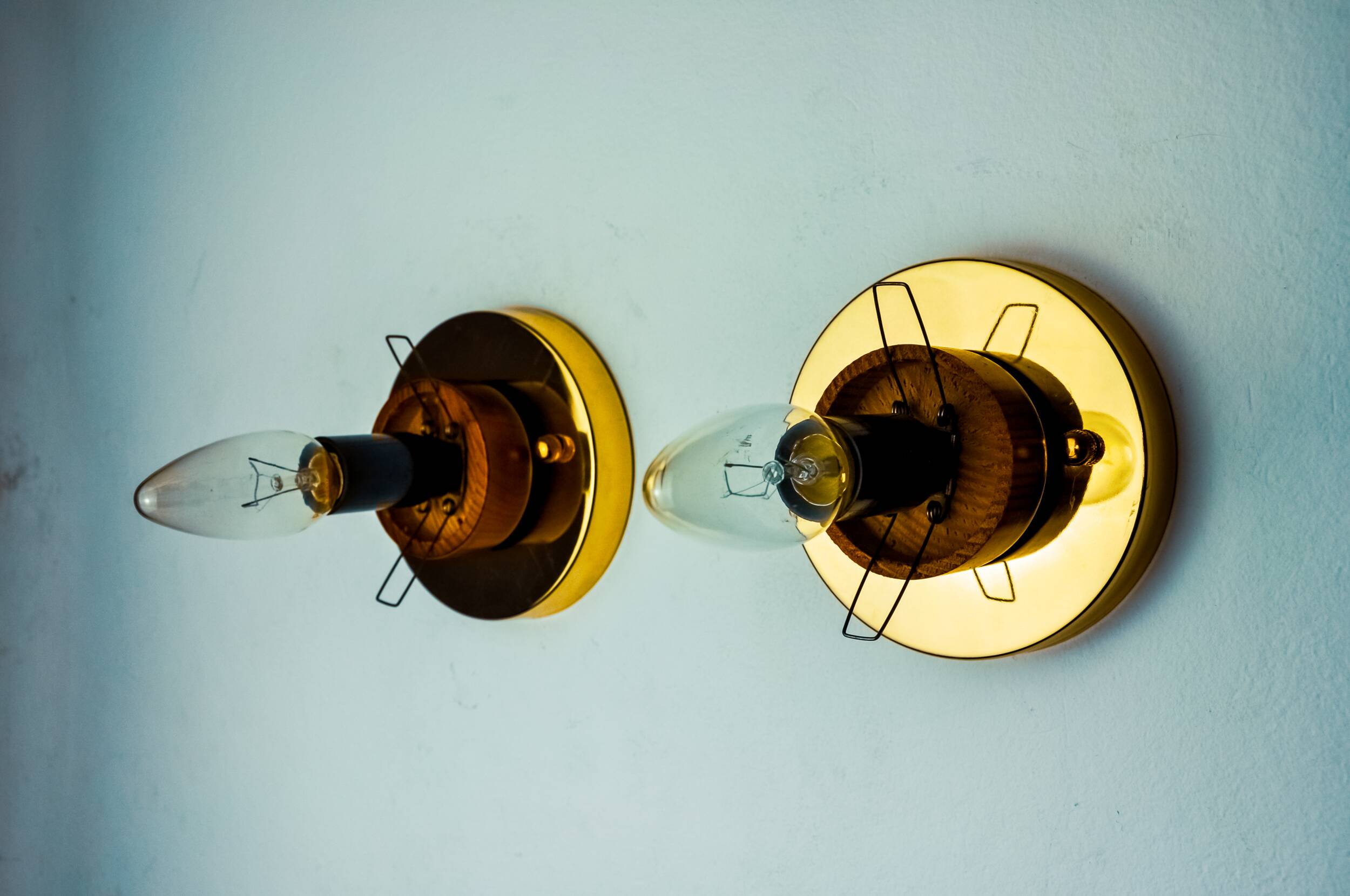 Pair of “cocoon” wall lights, resin and pine, italy, 1970