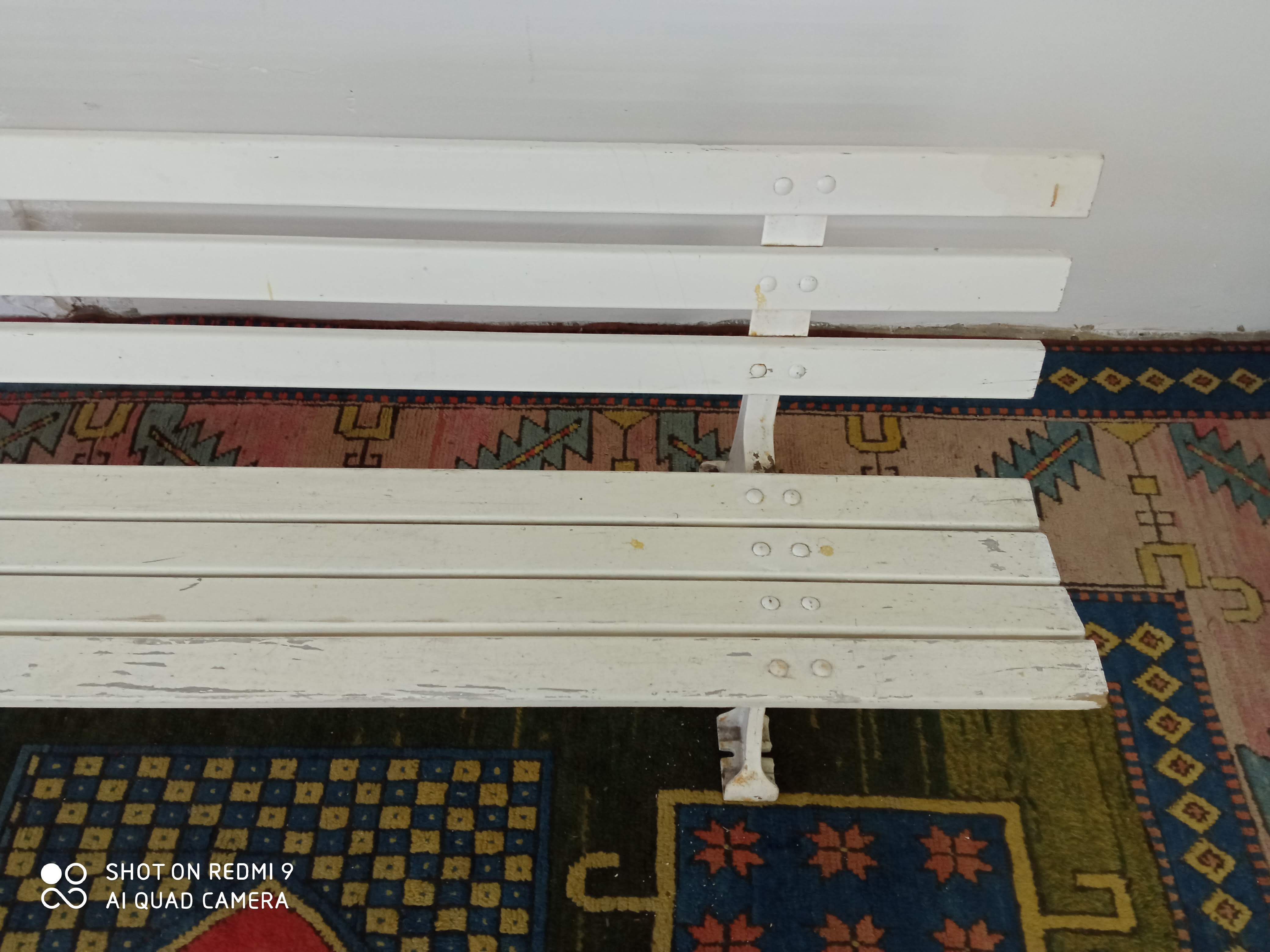 Wooden garden bench and old cast iron