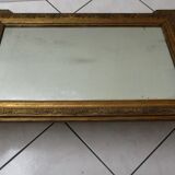 Mirror with gilded wood and stucco frame, early 20th century, 59x83cm