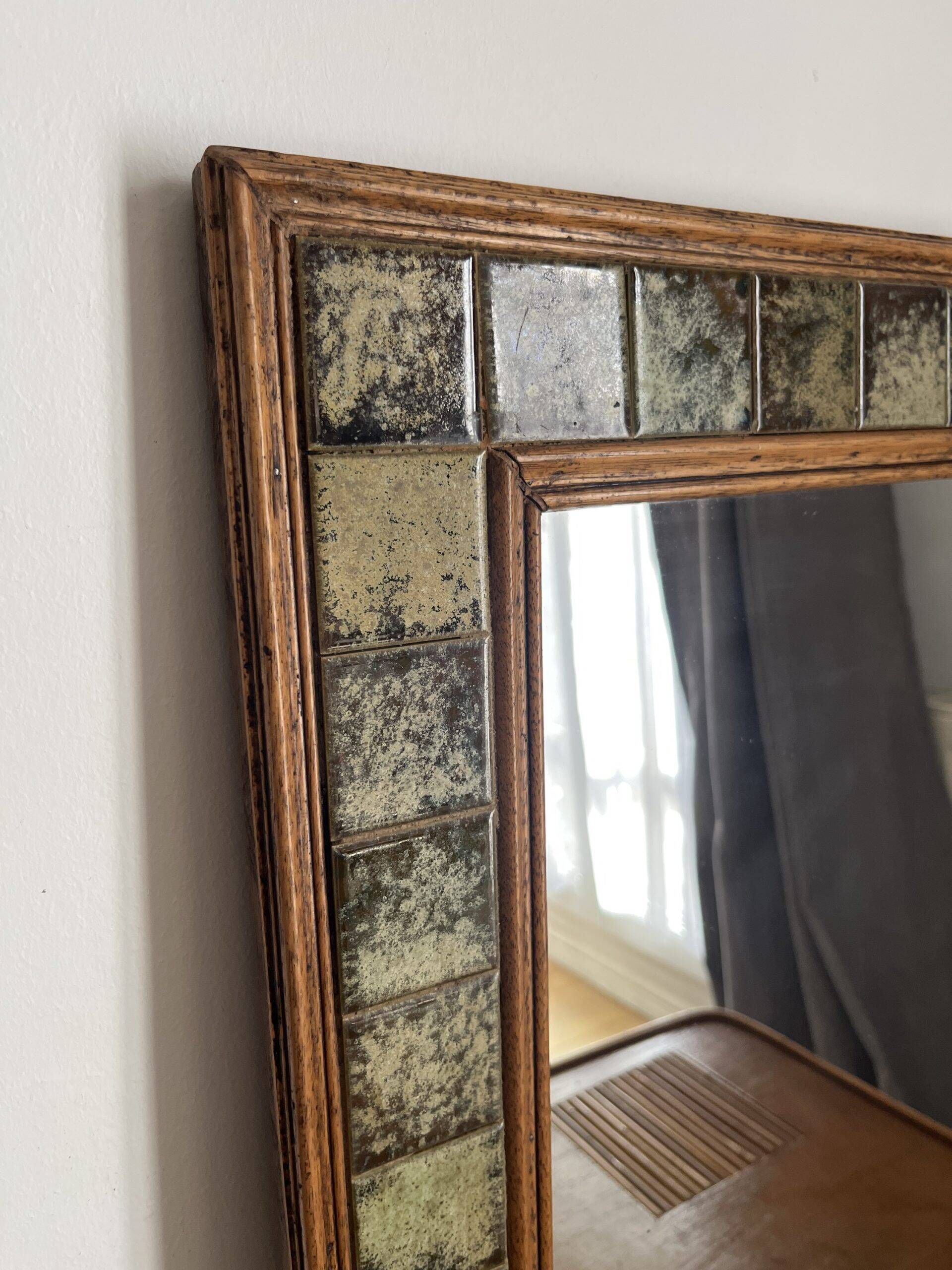 Vintage wall mirror in wood and ceramic tiles