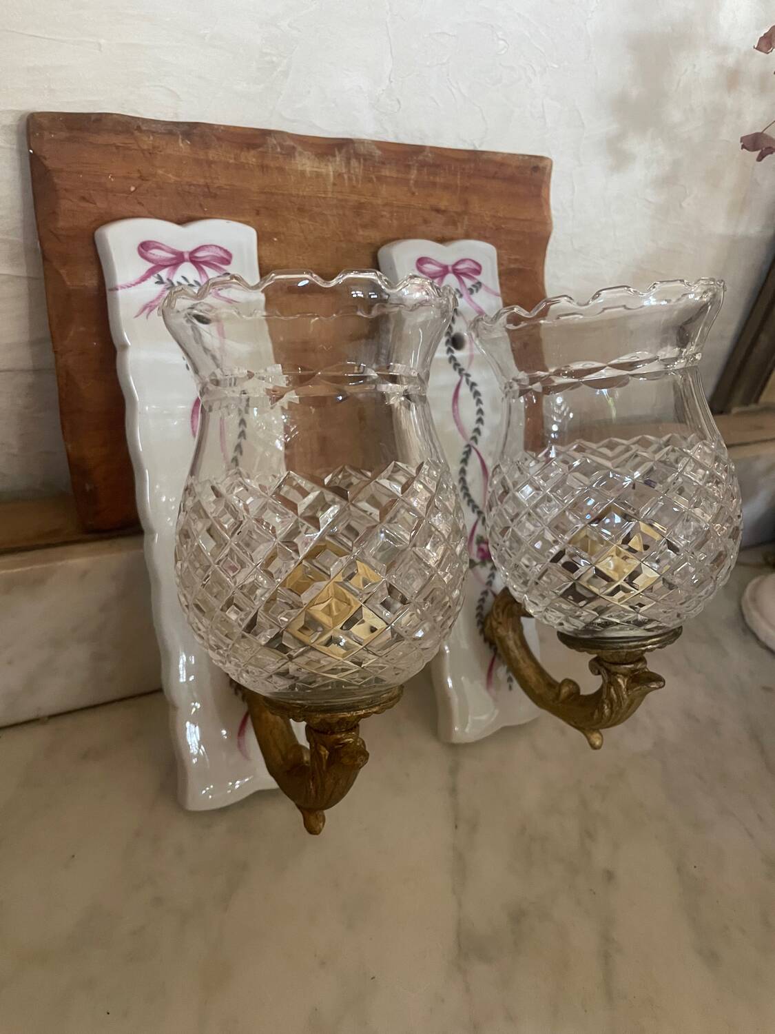 Pair of cut glass and Limoges porcelain wall sconces
