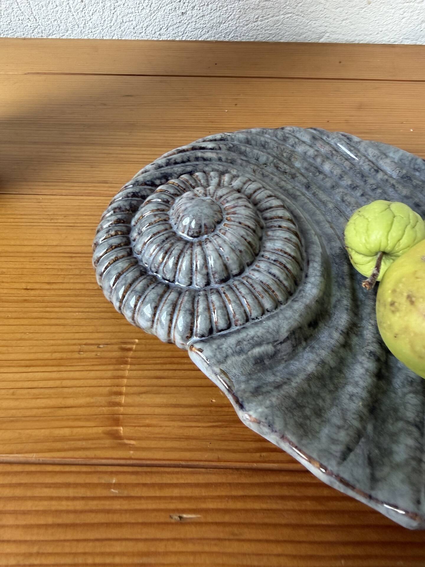 Shell-shaped ceramic catchall.