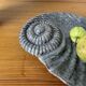 Shell-shaped ceramic catchall.