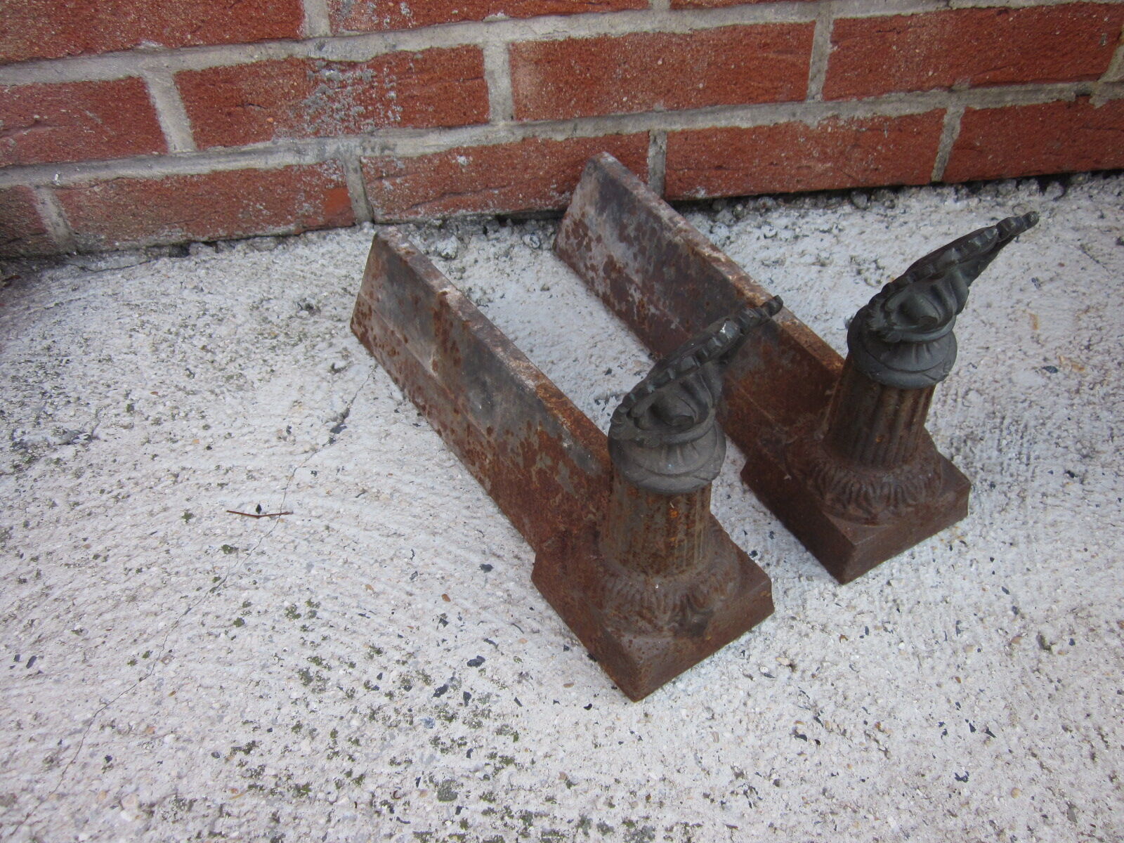 Pair of old cast-iron and bronze chenet