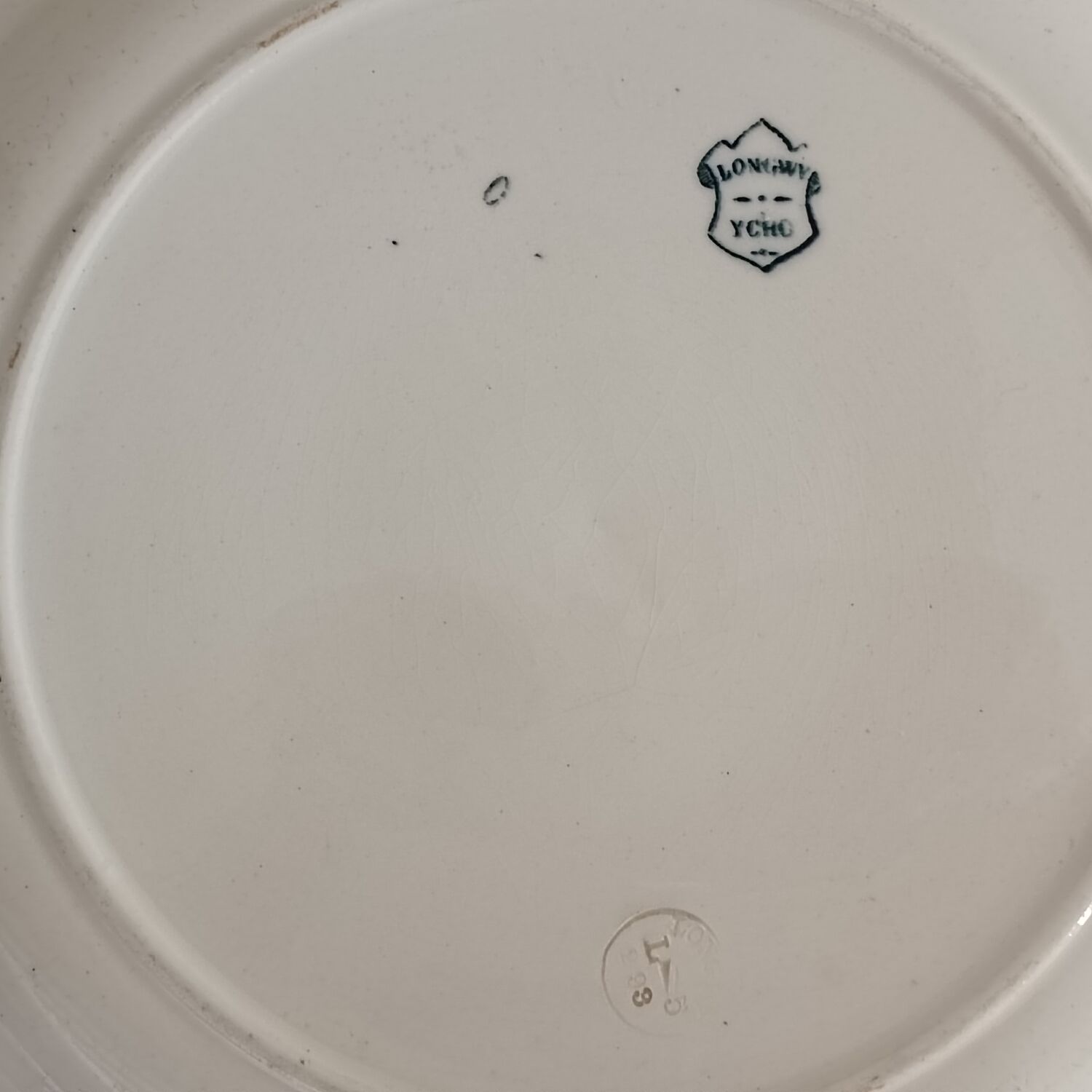 2 plates and a Longwy iron earth dish