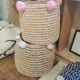 Moroccan basket with pale pink pompoms made of palm fiber