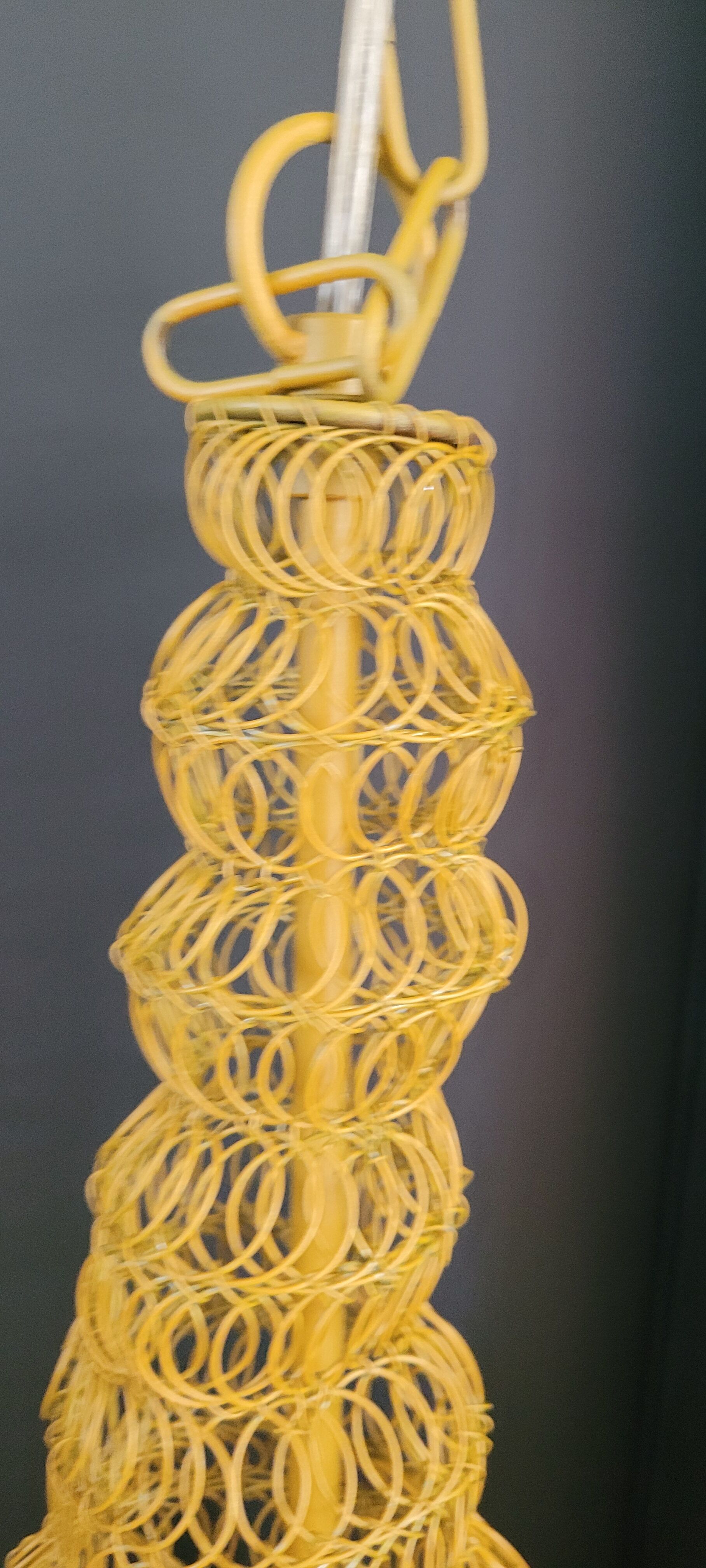 Mustard-coloured metal mesh suspension