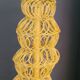 Mustard-coloured metal mesh suspension