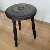 Black wooden tripod stool