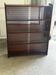 Vintage 1960s wooden library with sliding doors.