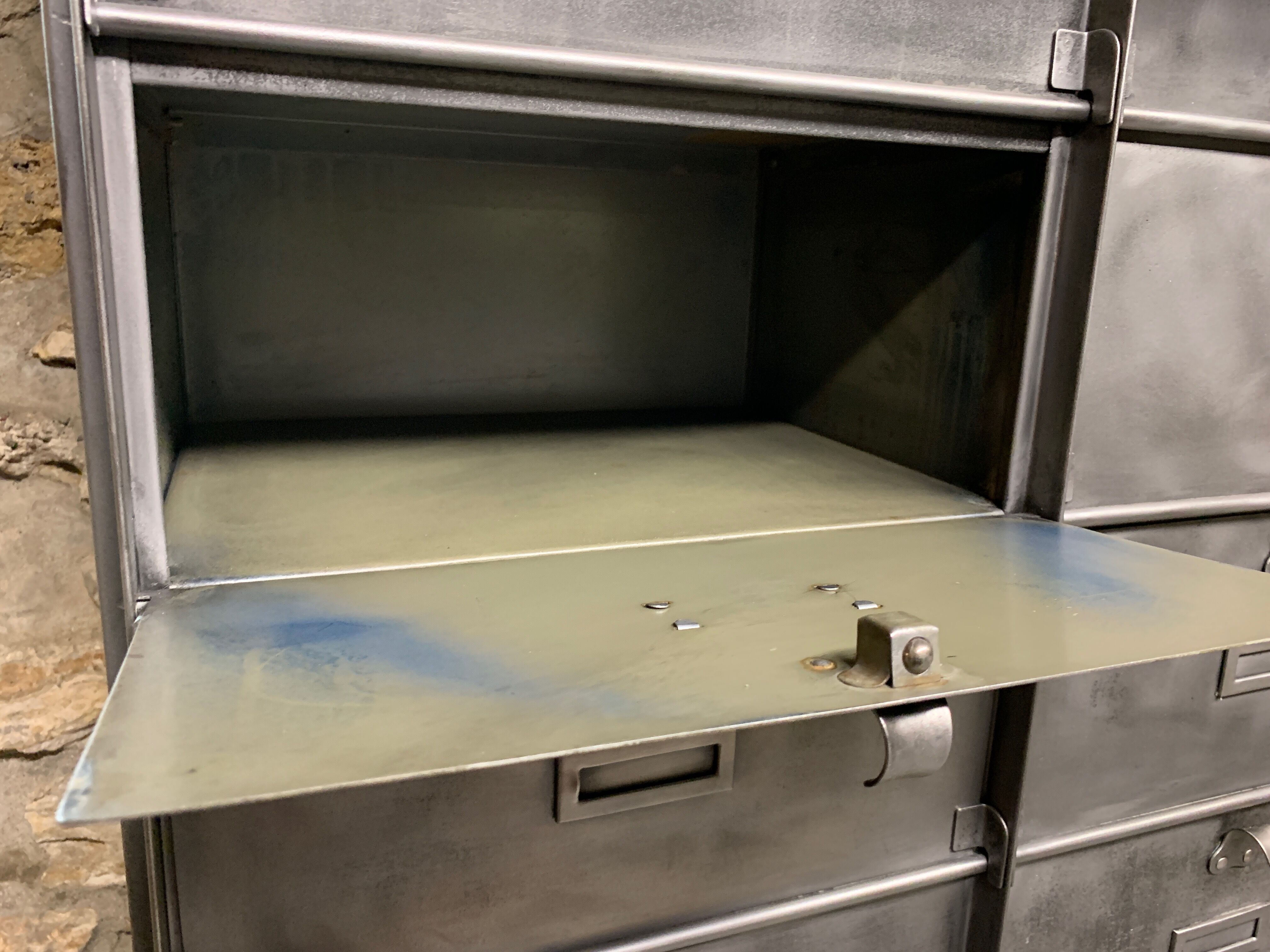 Industrial cladding furniture in brushed and patinated steel