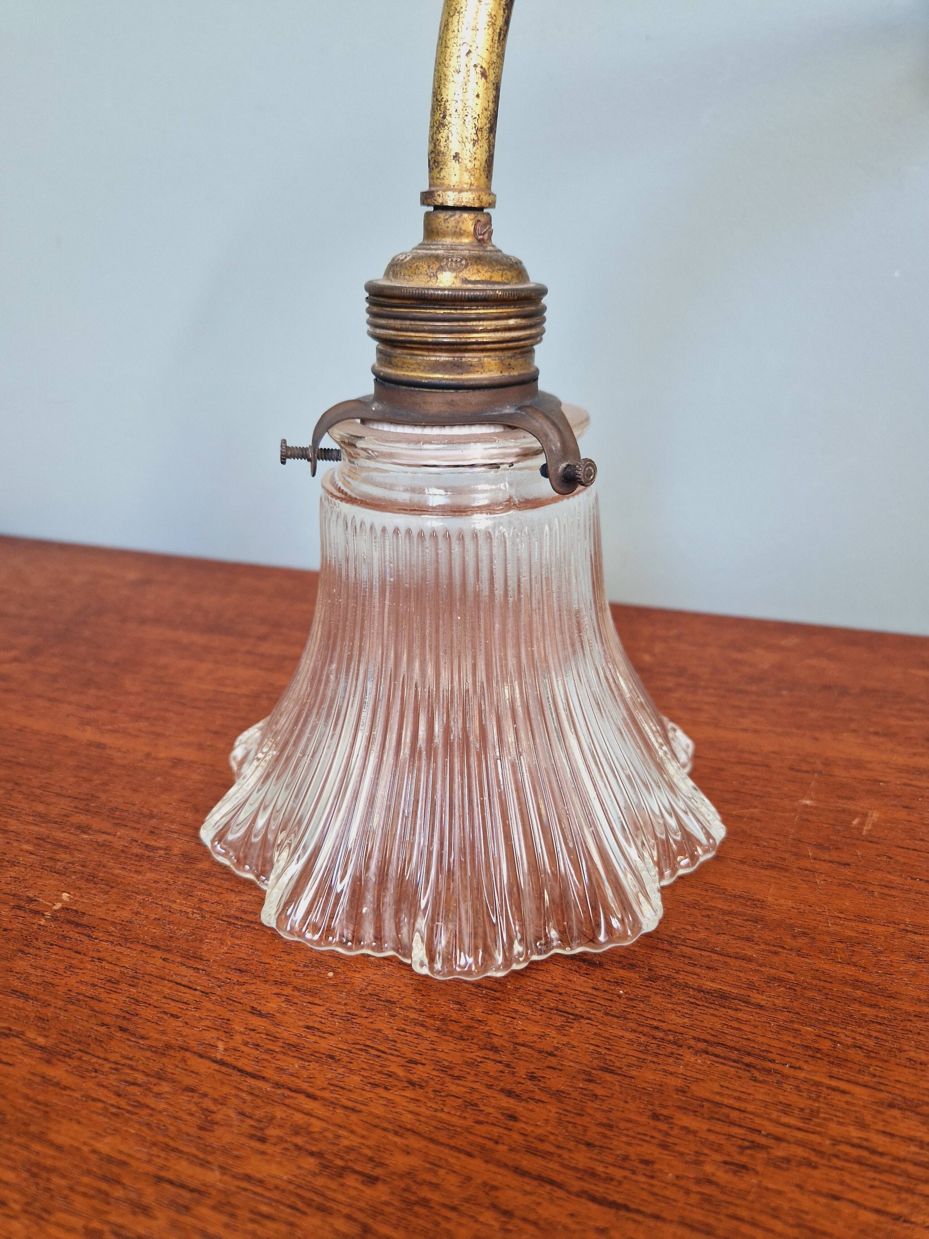 Bronze wall light with grooved clear glass, early 20th century