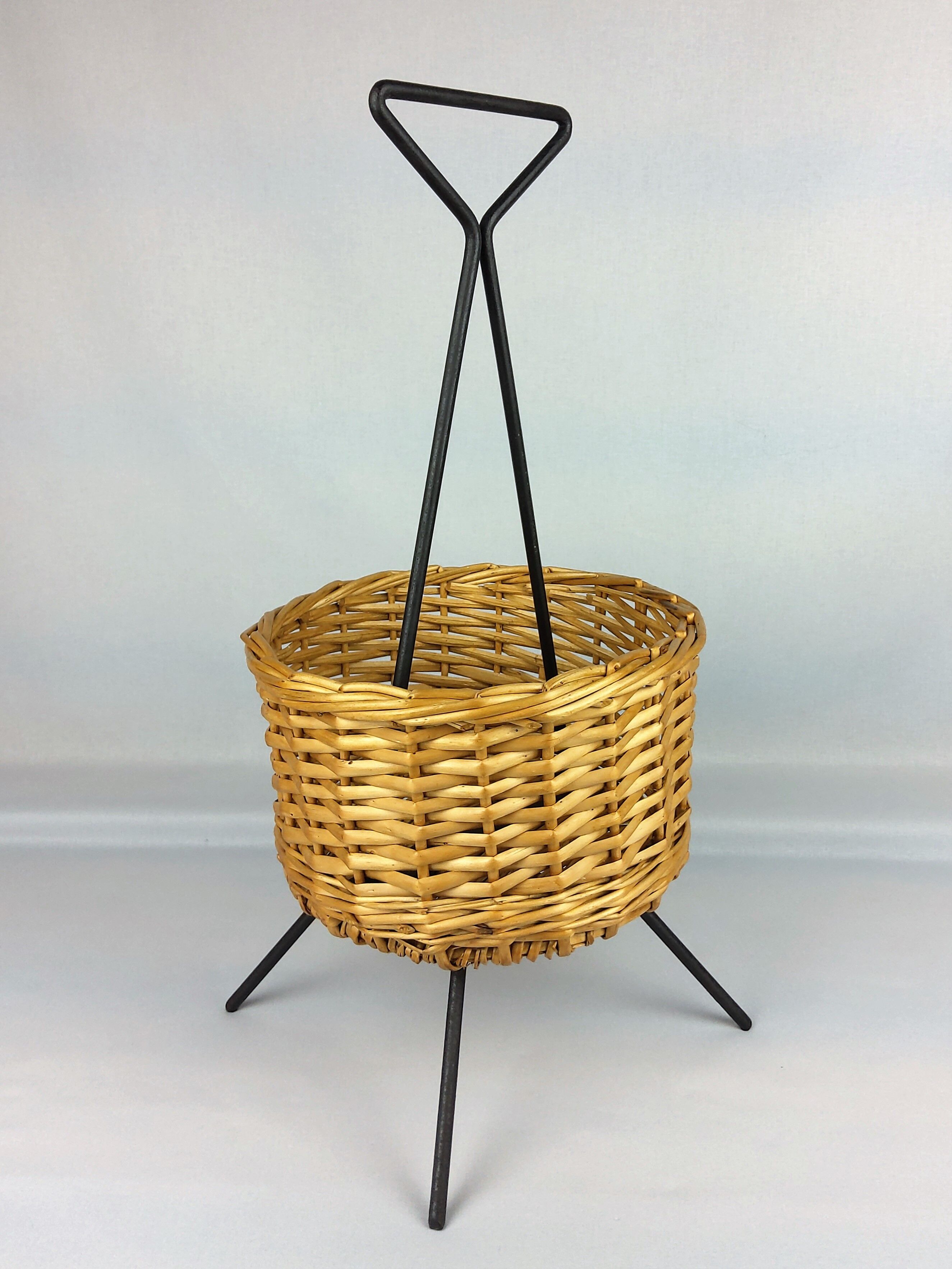 Black metal rattan trash can on 1960