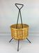 Black metal rattan trash can on 1960