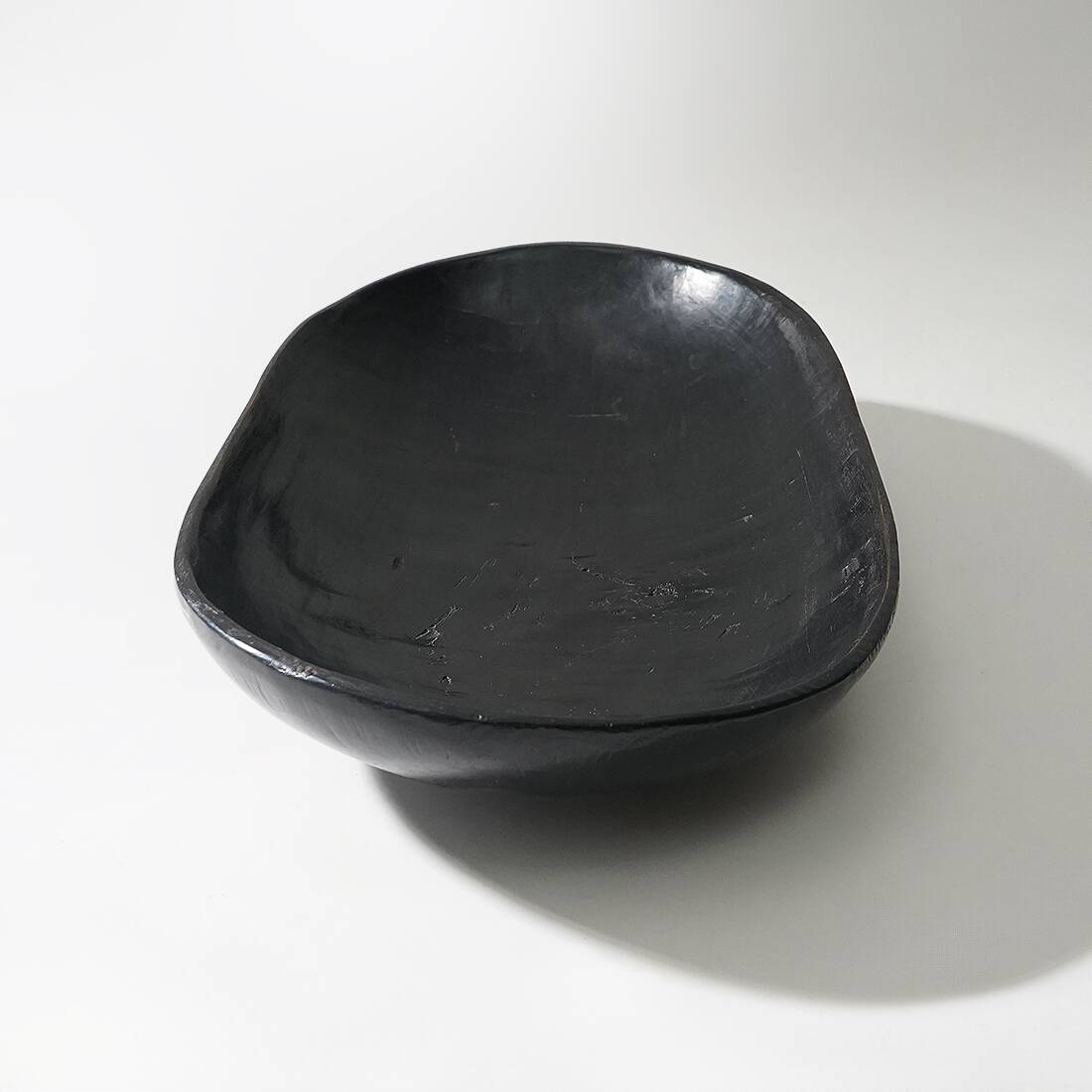 Organic shaped black wooden bowl, 1960s