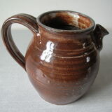 Old broc pitcher in terracotta signed and dated 87