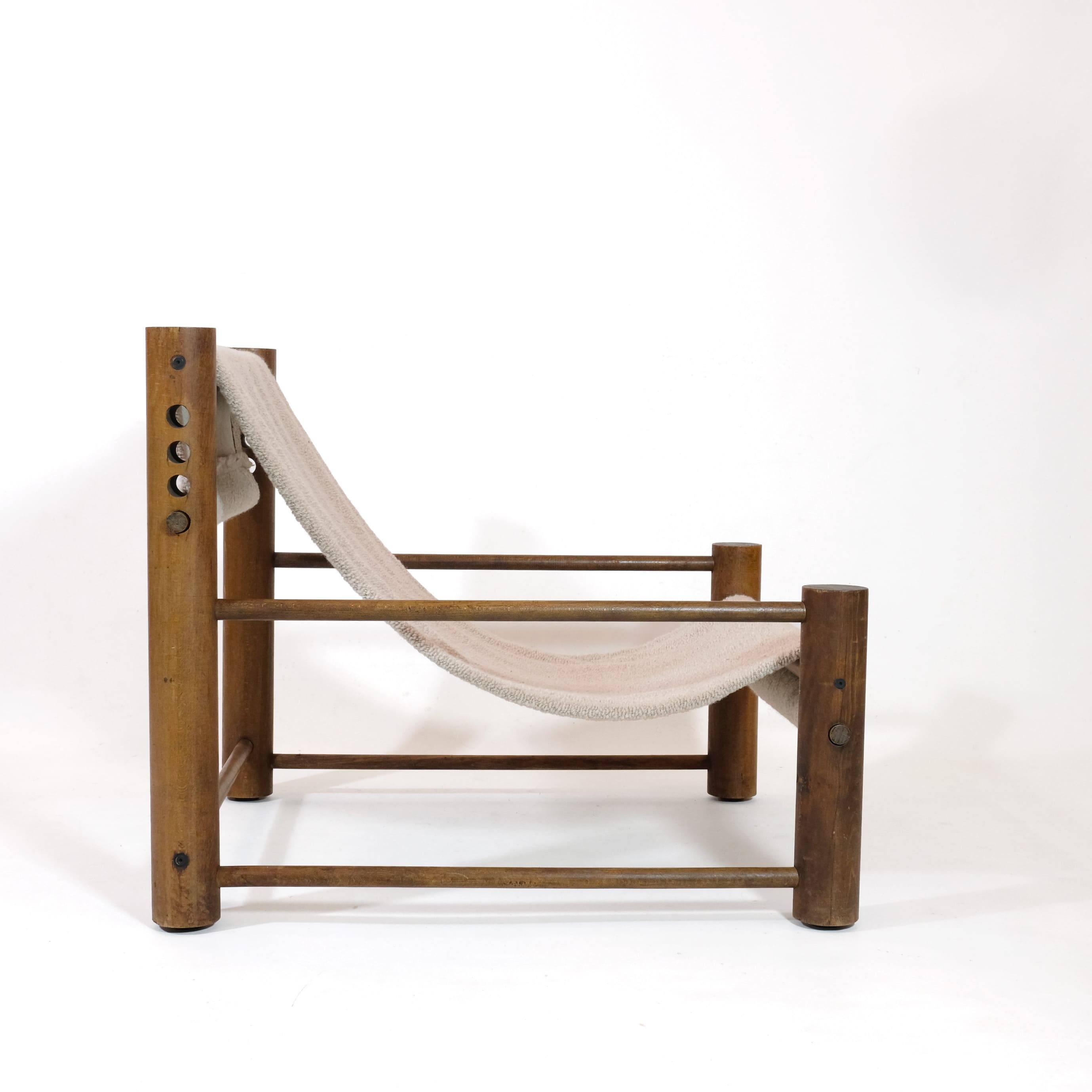 Solid wood armchair with adjustable backrest.