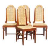 Ensemble de quatre chaises de salle à manger en rotin au design Art Déco avec dossier haut.