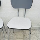Set of two vintage grey Formica and chrome chairs.