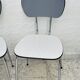 Set of two vintage grey Formica and chrome chairs.