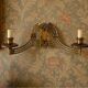 Art Nouveau style brass double piano wall lamp