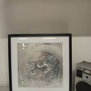 a Kinetic Op Art Aluchromy under glass frame.