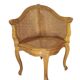 Armchair in solid oak with caning and a central leg (known as couillard), 89x68cm.