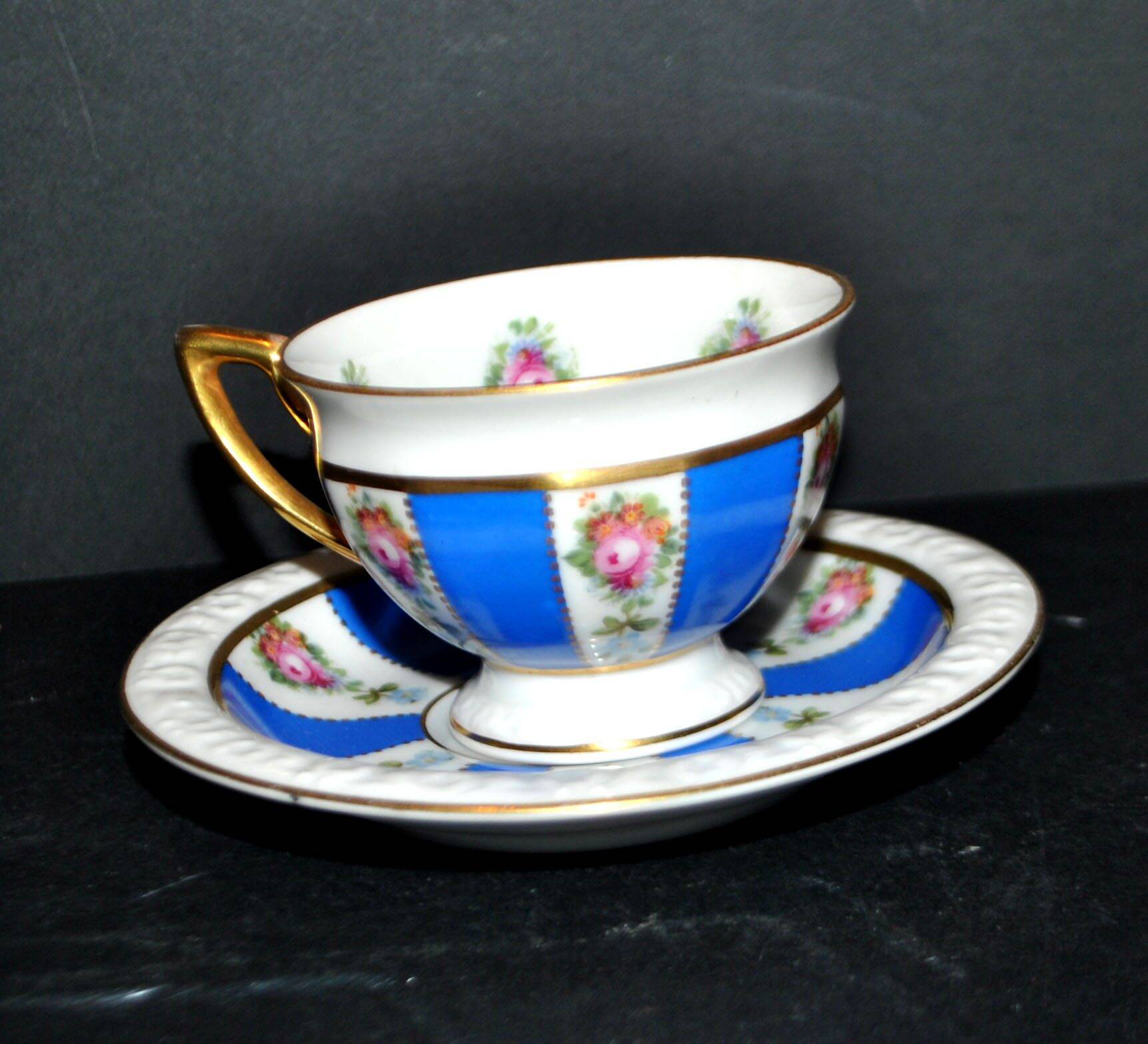 Maria collector's cup in blue and gold German porcelain.