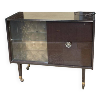 old fornica bar cabinet on casters.
