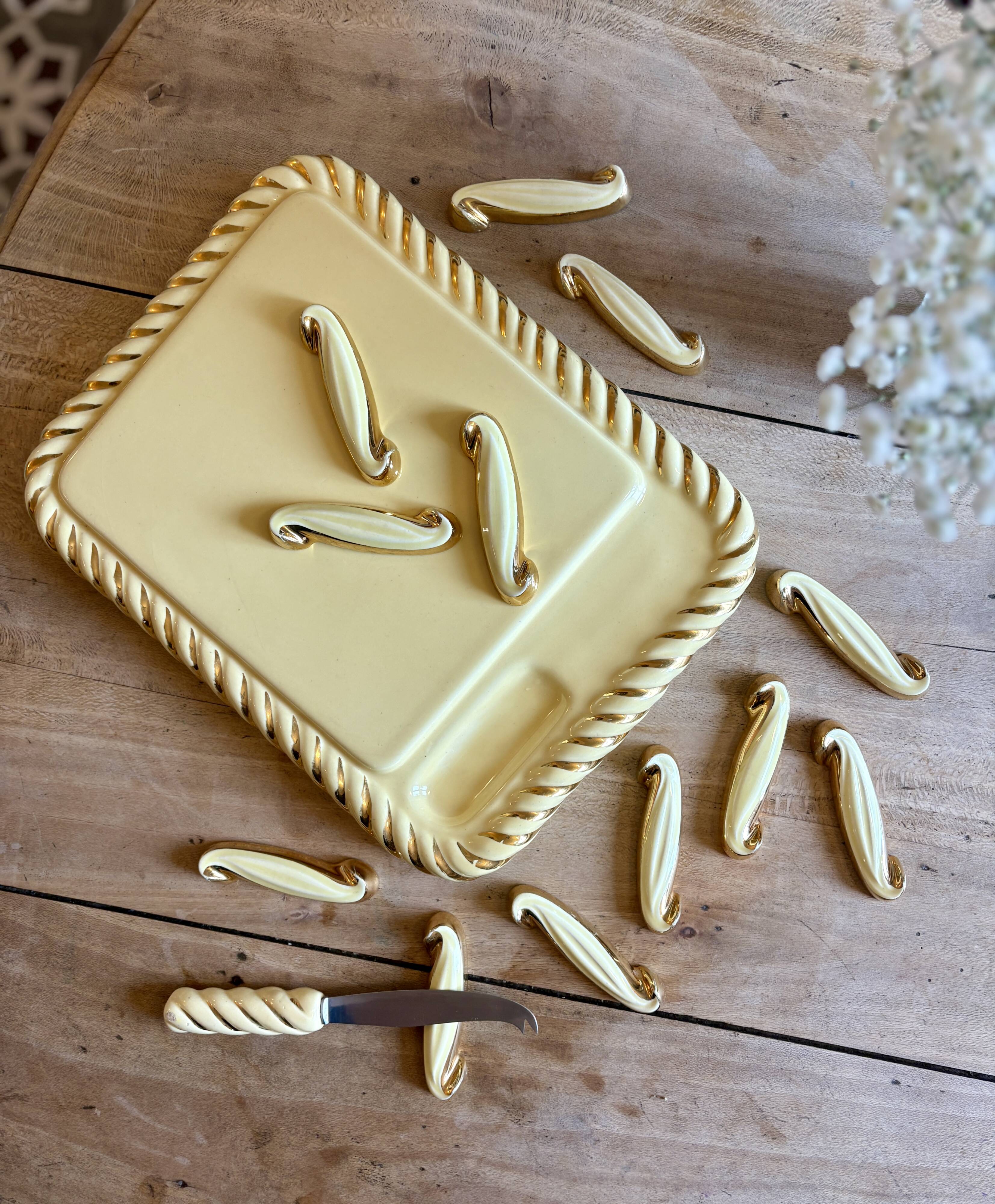 Set of 12 vintage art deco yellow and gold ceramic knife rests