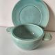 Earthenware bowl and saucer in glazed water green ceramic.