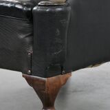 Antique black English cow leather wingback armchair from the 19th century