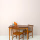 Scandinavian table with sliding panels.