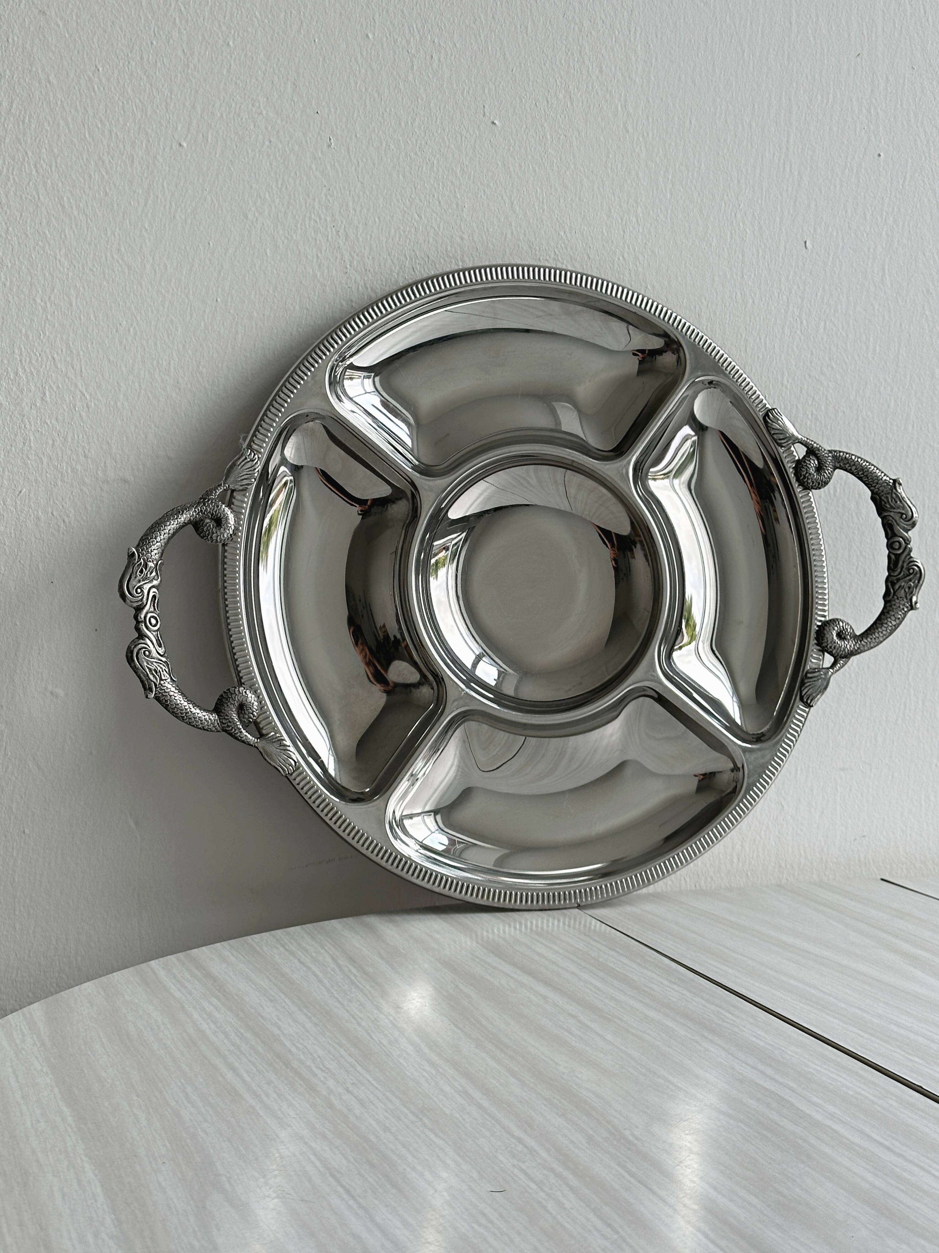 Vintage silver-plated metal serving tray with compartments.