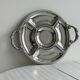 Vintage silver-plated metal serving tray with compartments.