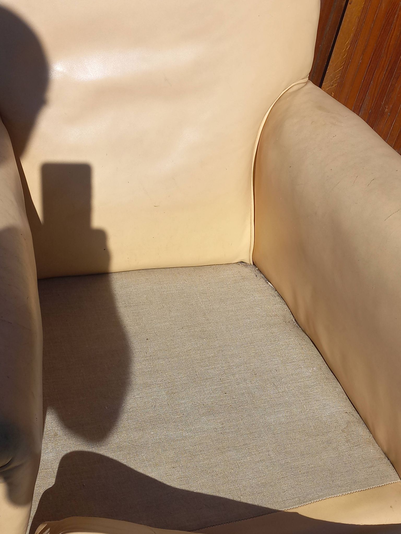 Pair of 1930s club armchairs in ivory leather.