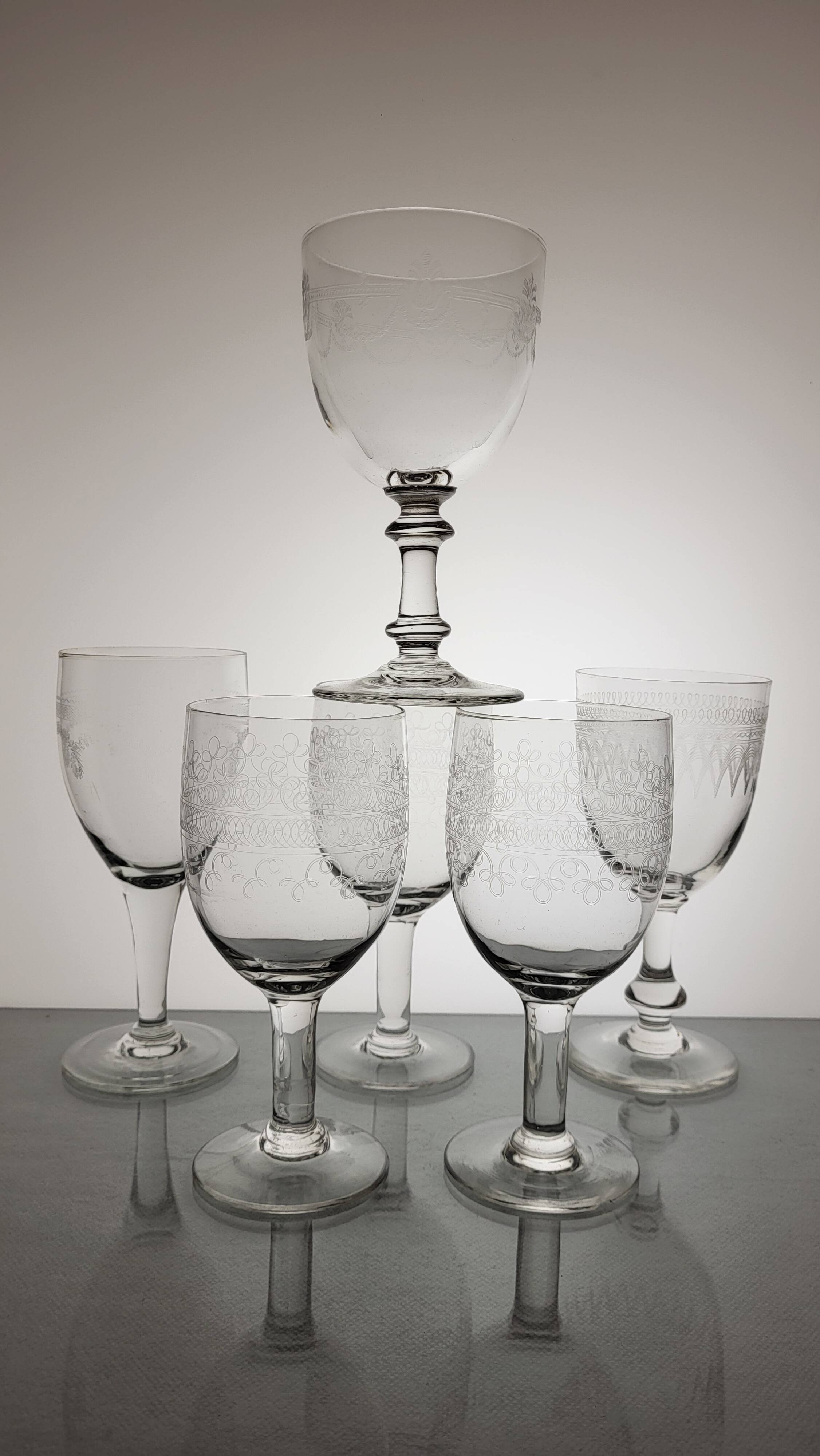 6 mismatched old wine/water glasses from the early 20th century.