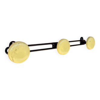 Vintage yellow metal wall coat rack