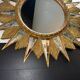 Golden sunburst mirror with wooden rays - 1950s