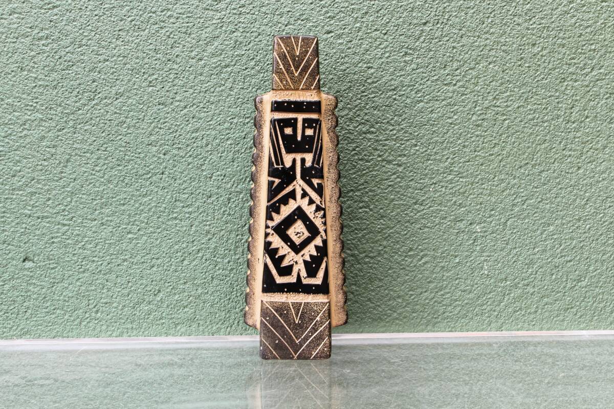 Modernist ceramic vase, signed, with incised geometric tribal decoration.