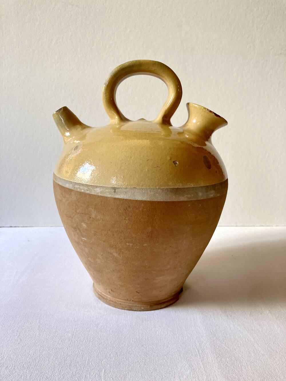 Yellow glazed terracotta gargoulette