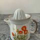 Vintage stoneware jug and its citrus juicer.