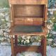 A small piece of Bonheur du jour with detached columns in Empire-era mahogany.
