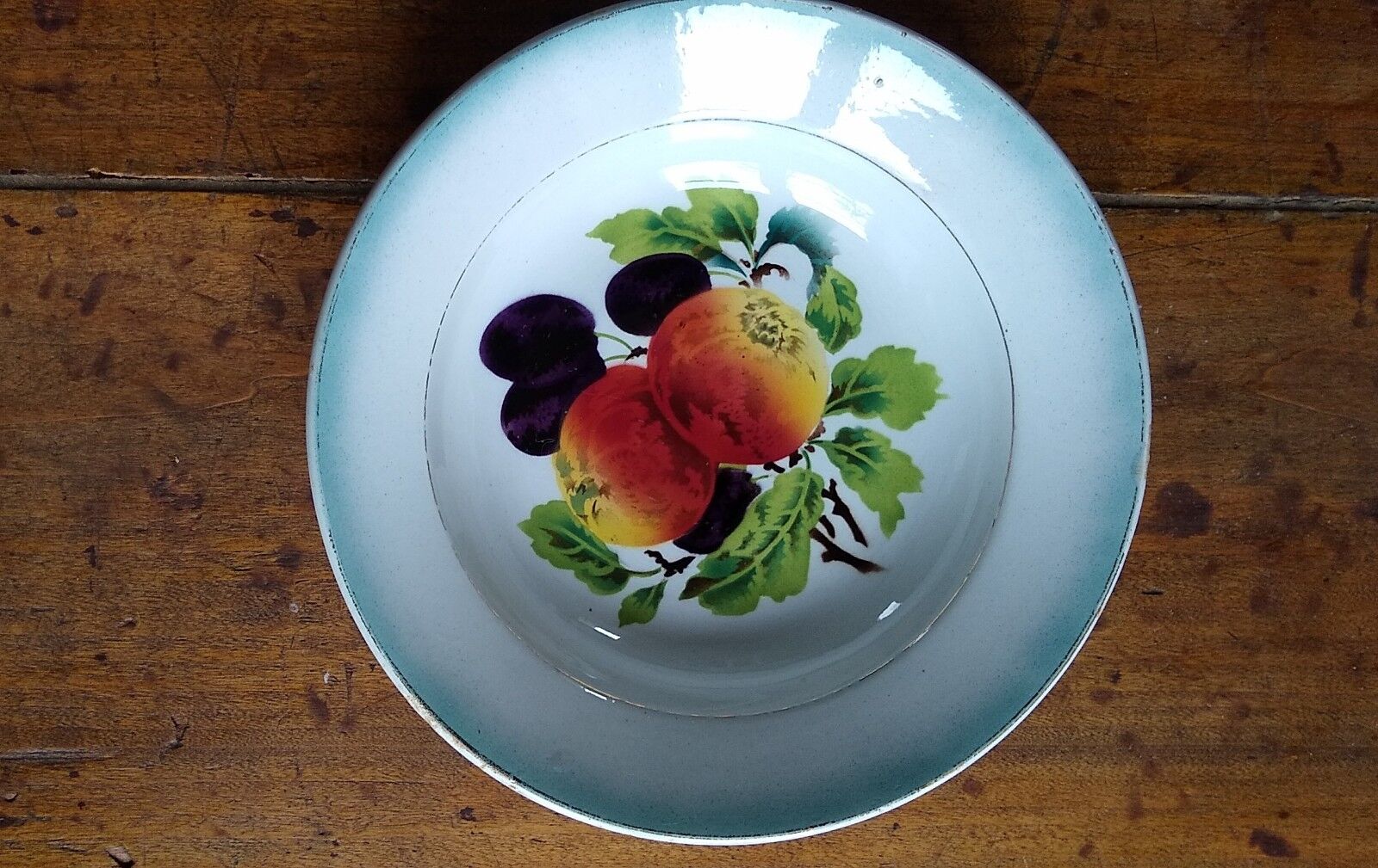 Round dish in Earthenware St Amand decorated with fruit apples and plums